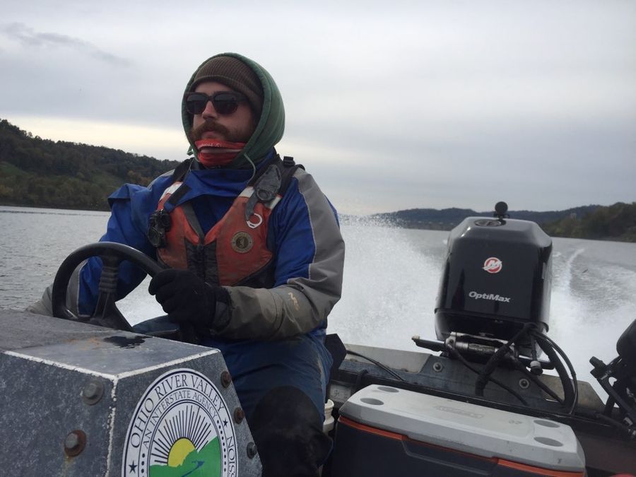 Driving a sampling boat on a river