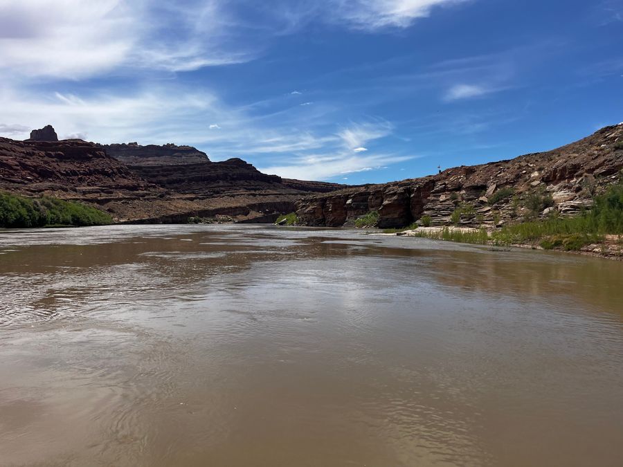 The Colorado River running between red rock canyon walls